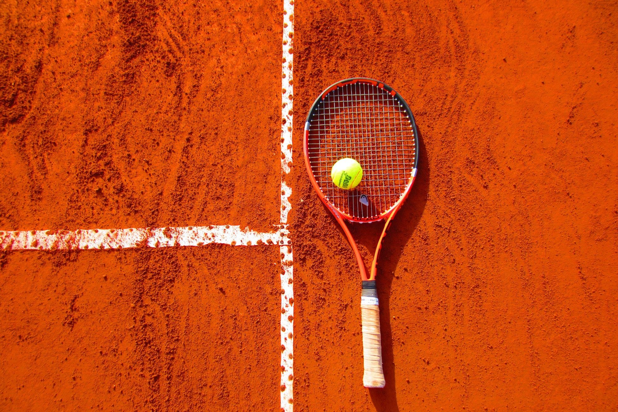 The Evolution of Tennis Equipment: From Wooden Rackets to Carbon Composites